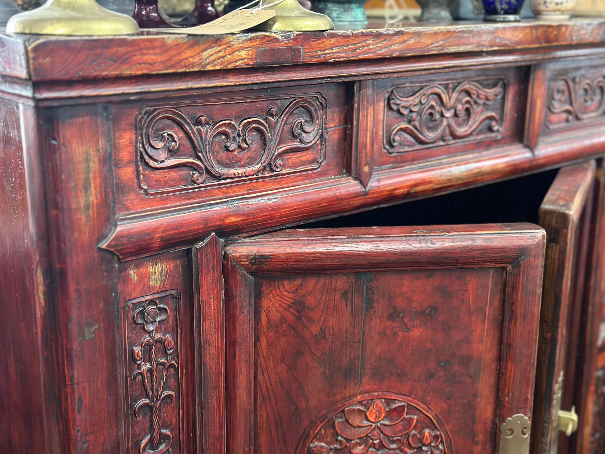 Elegant 19th-century Chinese marriage cabinet with intricate craftsmanship, multiple storage sections, and a hidden compartment