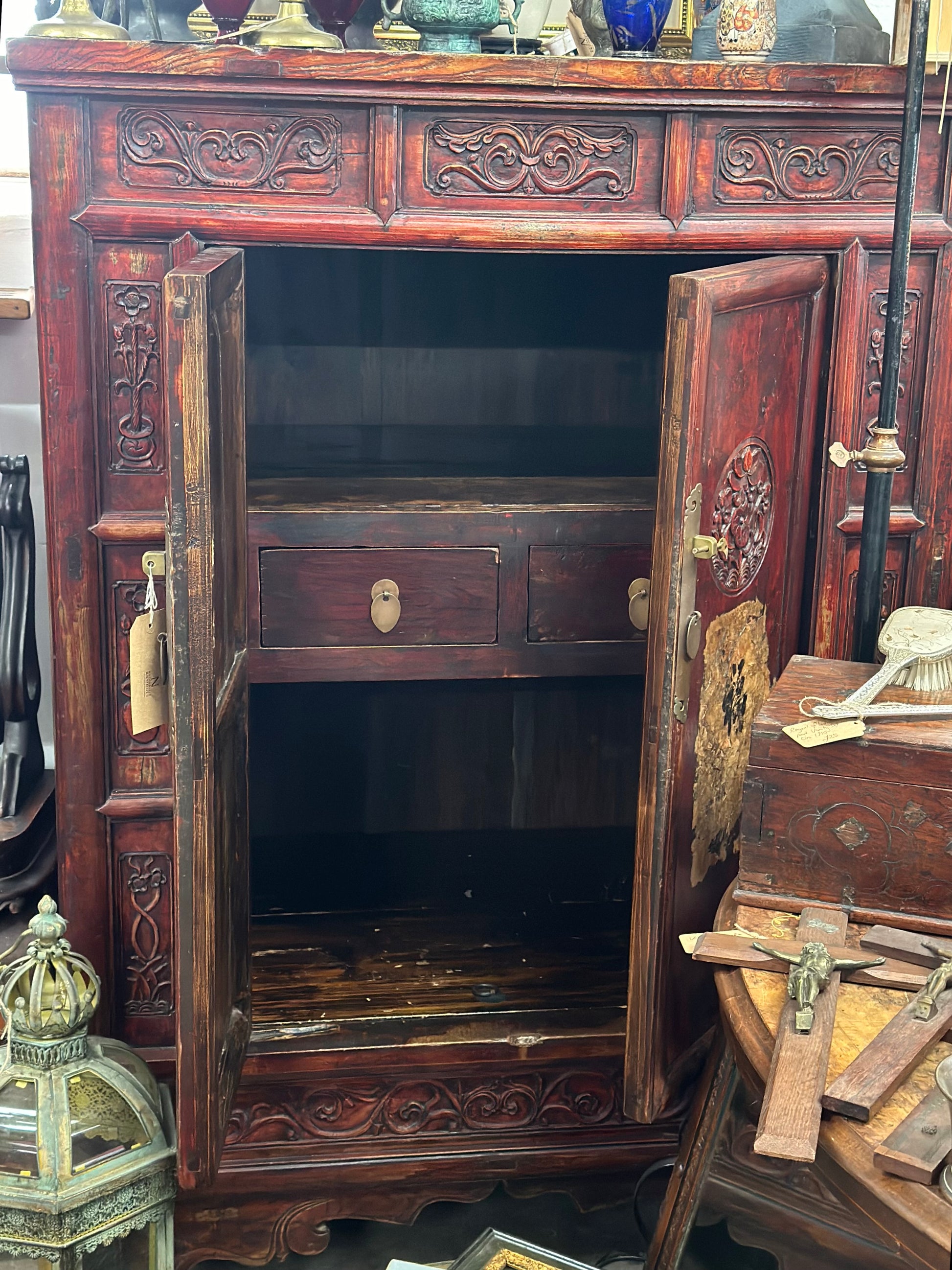 Antique Chinese marriage cabinet from the late 1800s, well-preserved with storage drawers, a shelf, and a secret compartment