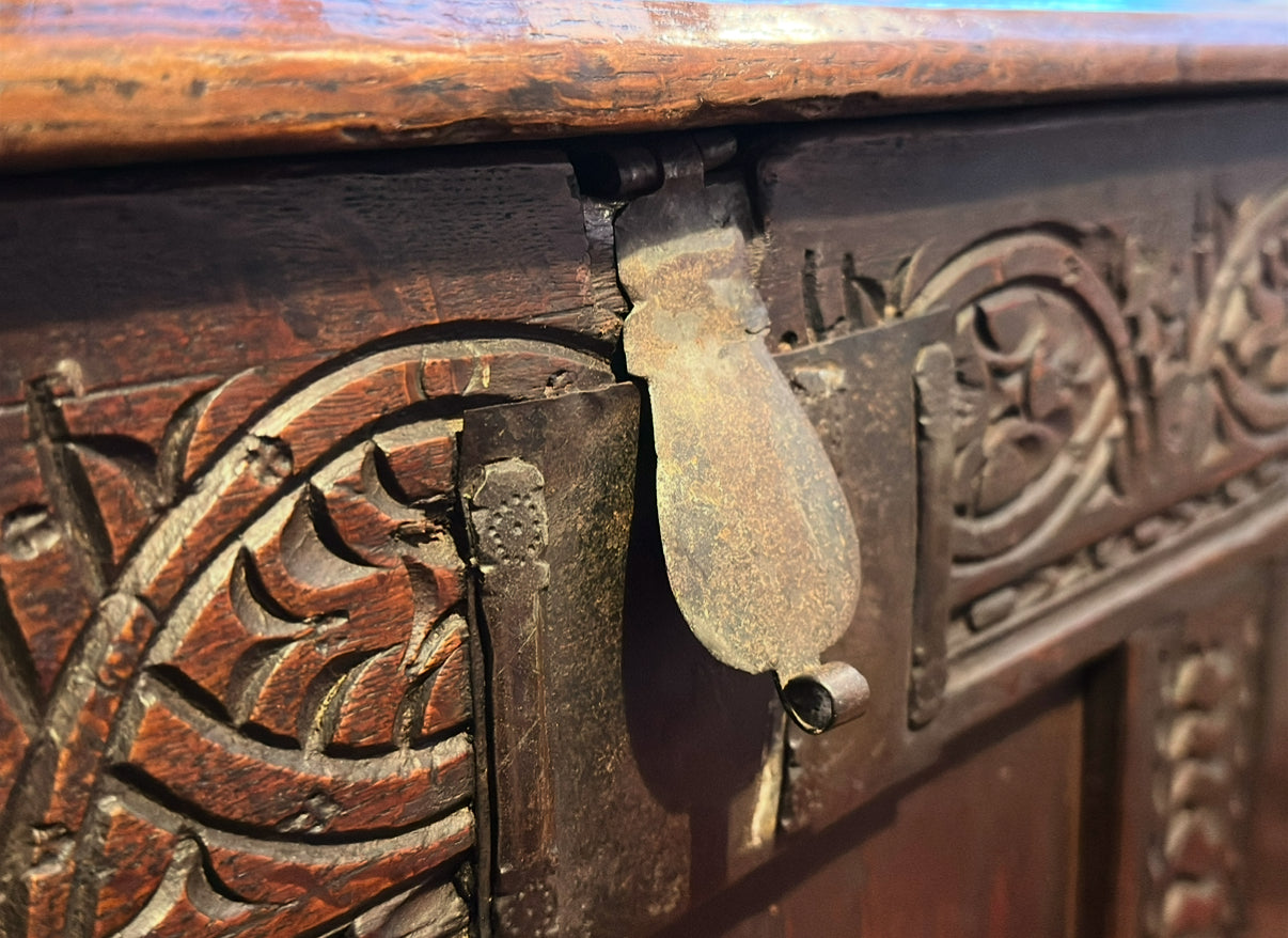 Stunning large late 17th/early 18th-century carved oak coffer with iron pin hinges, original candle box, and ironwork